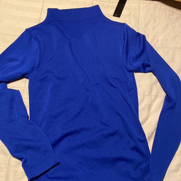 Woman blue top very stretchy size L but will fit S & M too - Picture 4 of 4
